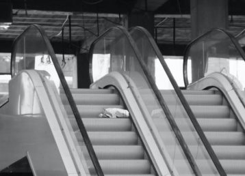white and gray escalator